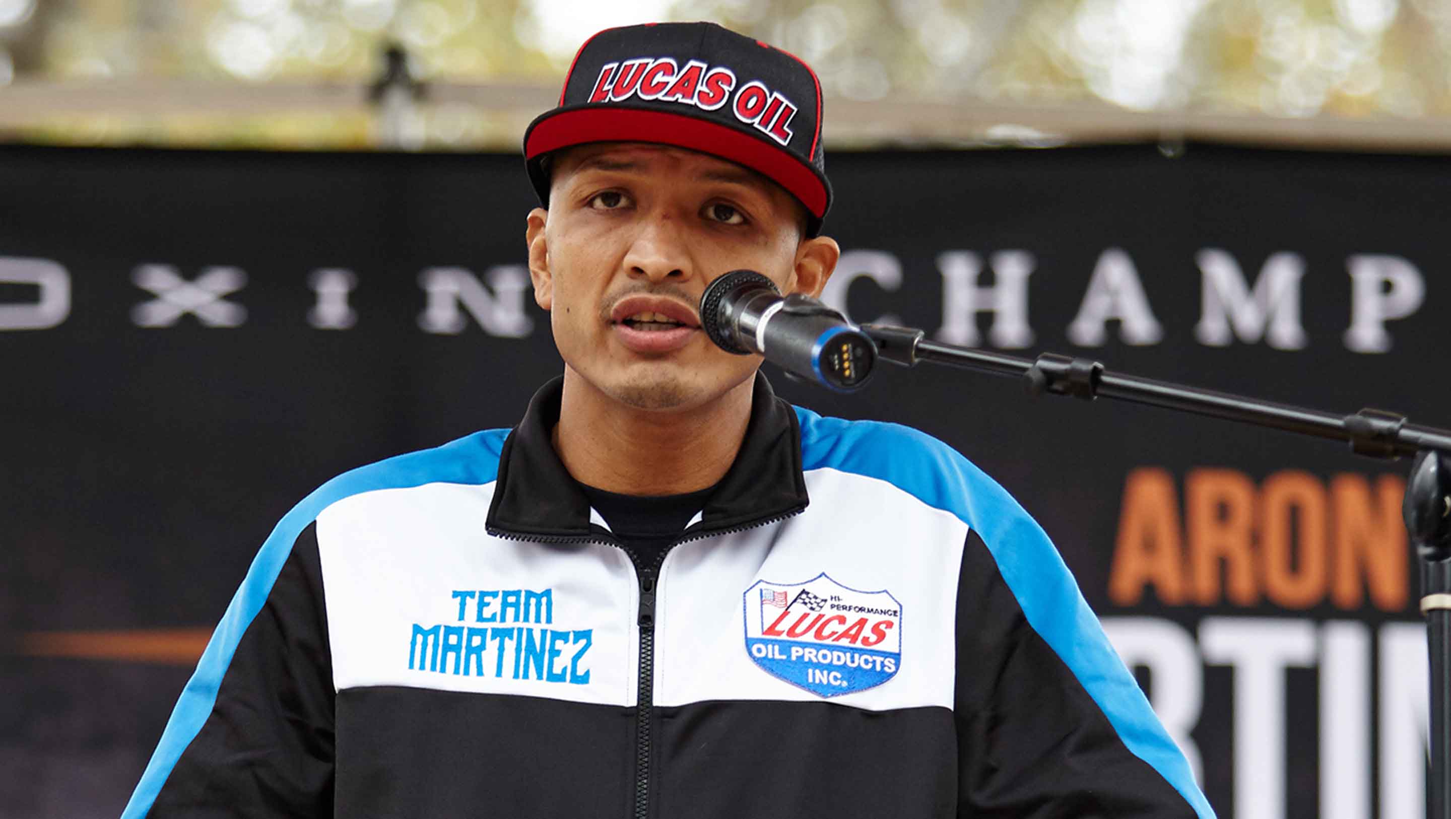 Martinez at the podium