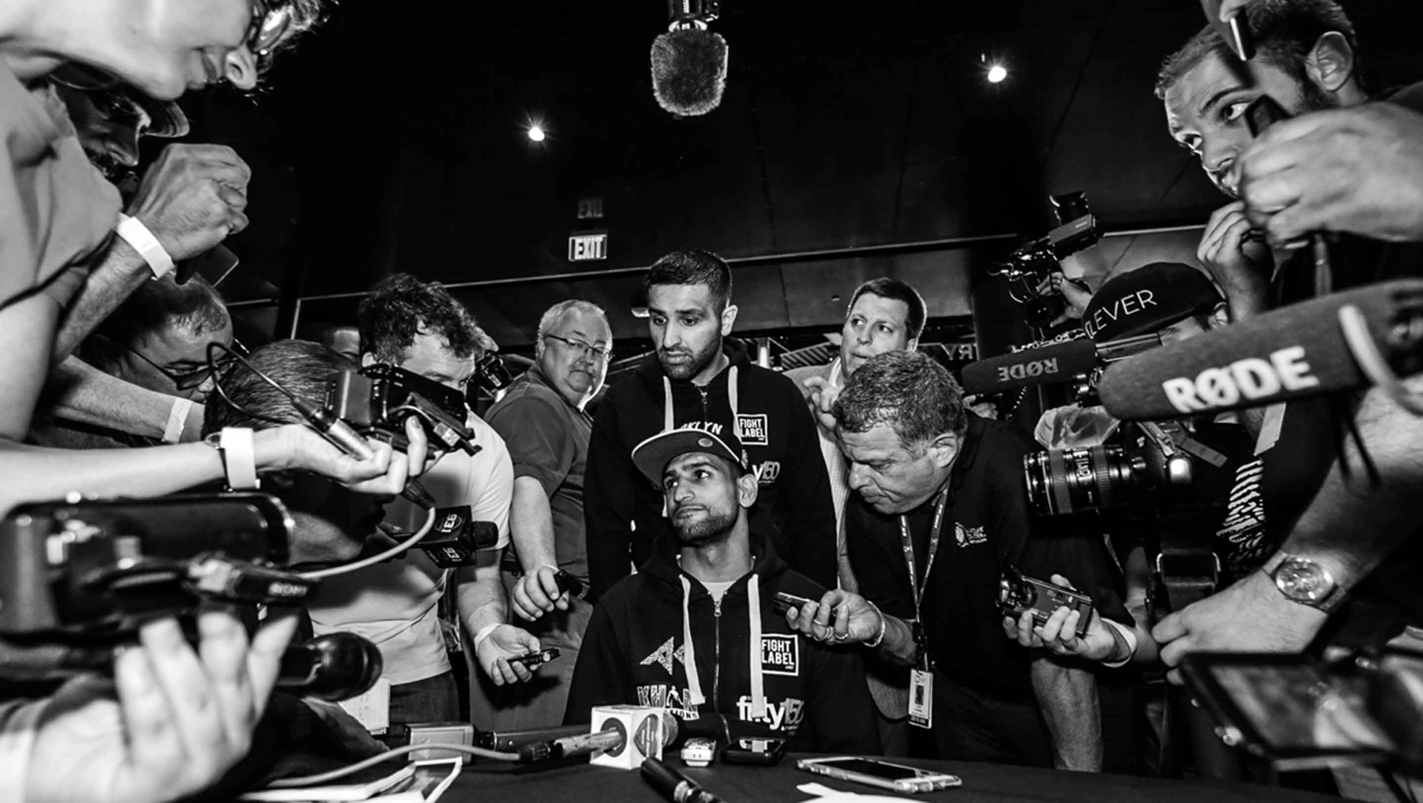 Khan faces a media scrum